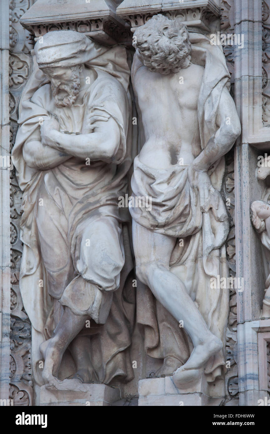 Atlantes supporting the main facade of the Milan Cathedral (Duomo di Milano) in Milan, Lombardy, Italy. Stock Photo