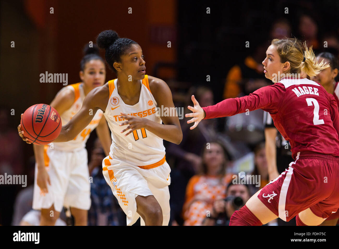 January 31, 2016: Diamond DeShields #11 of the Tennessee Lady Volunteers passes the ball around Trista Magee #2 of the Alabama Crimson Tide during the NCAA basketball game between the University of Tennessee Lady Volunteers and the University of Alabama Crimson Tide at Thompson Boling Arena in Knoxville TN Tim Gangloff/CSM Stock Photo