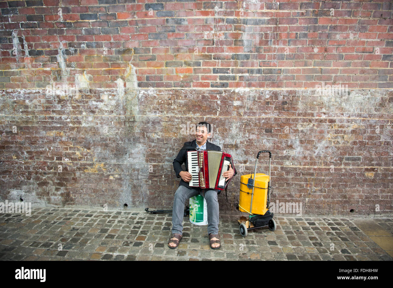 A man playing an accordion on the streets in London, England Stock Photo Alamy