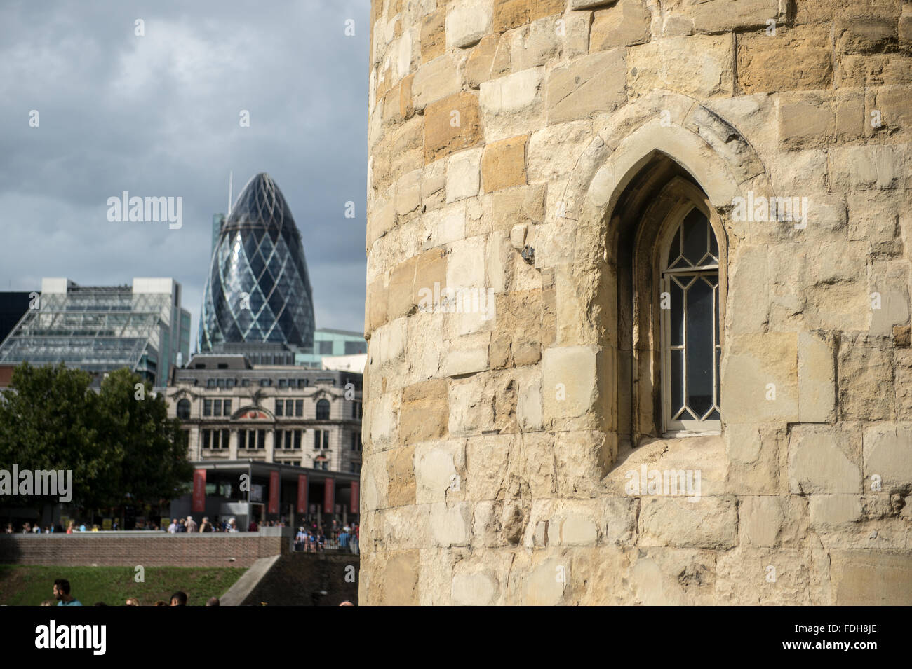 Window at Tower of London with The Gherkin skyscraper in the background in England, UK. Stock Photo