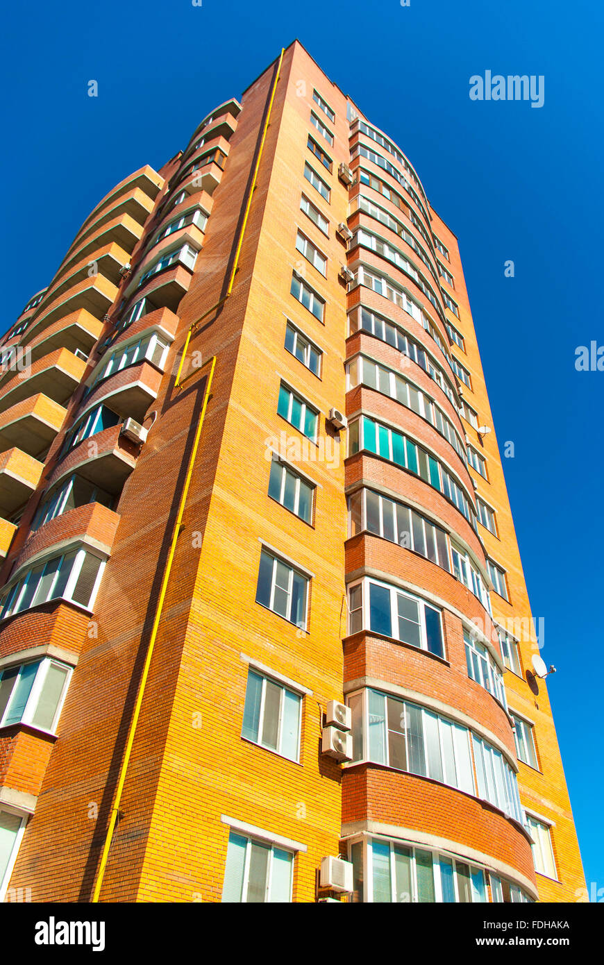 high residential house on blue sky background with trees Stock Photo ...