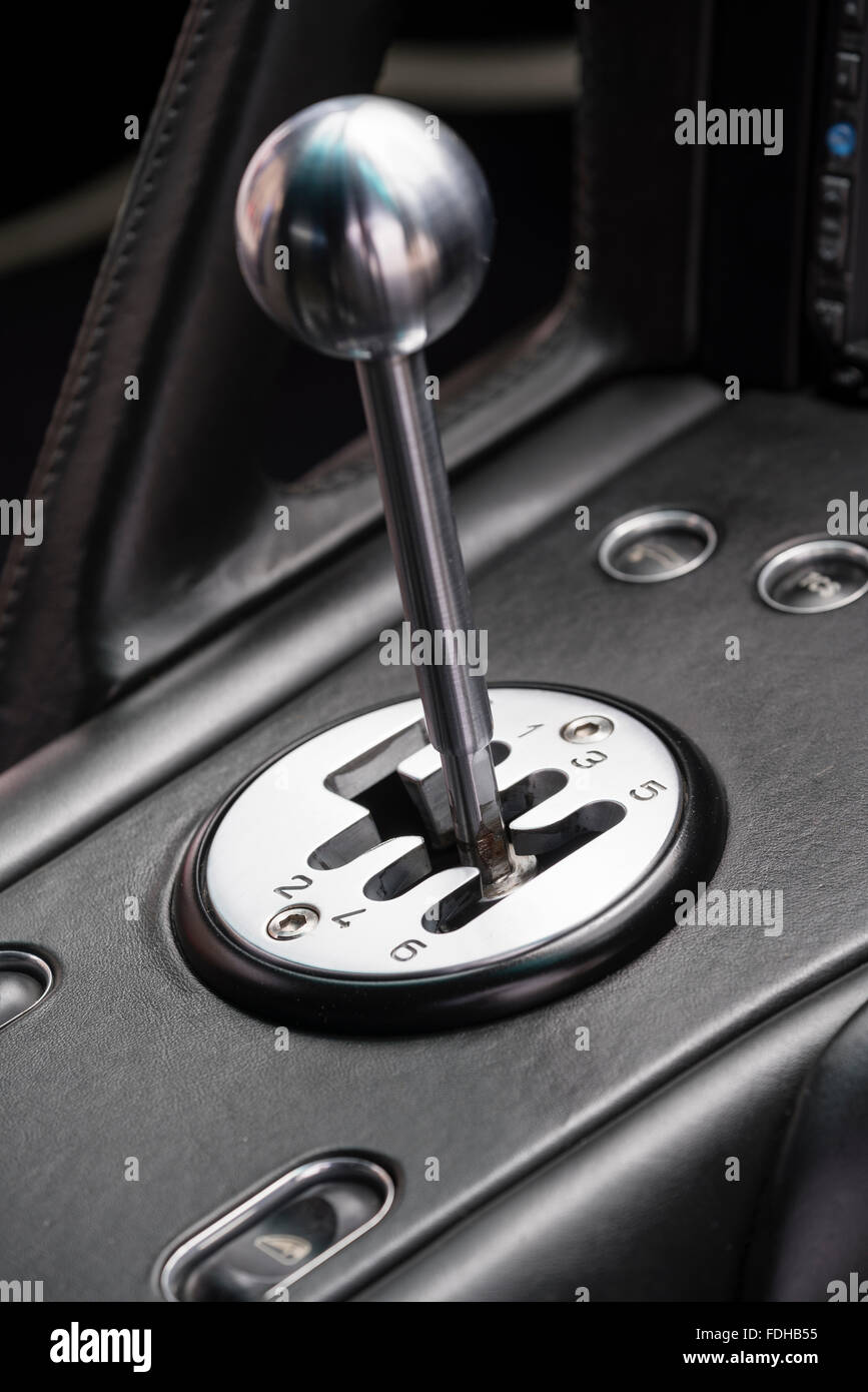 H-pattern metallic gear lever inside a sports car Stock Photo
