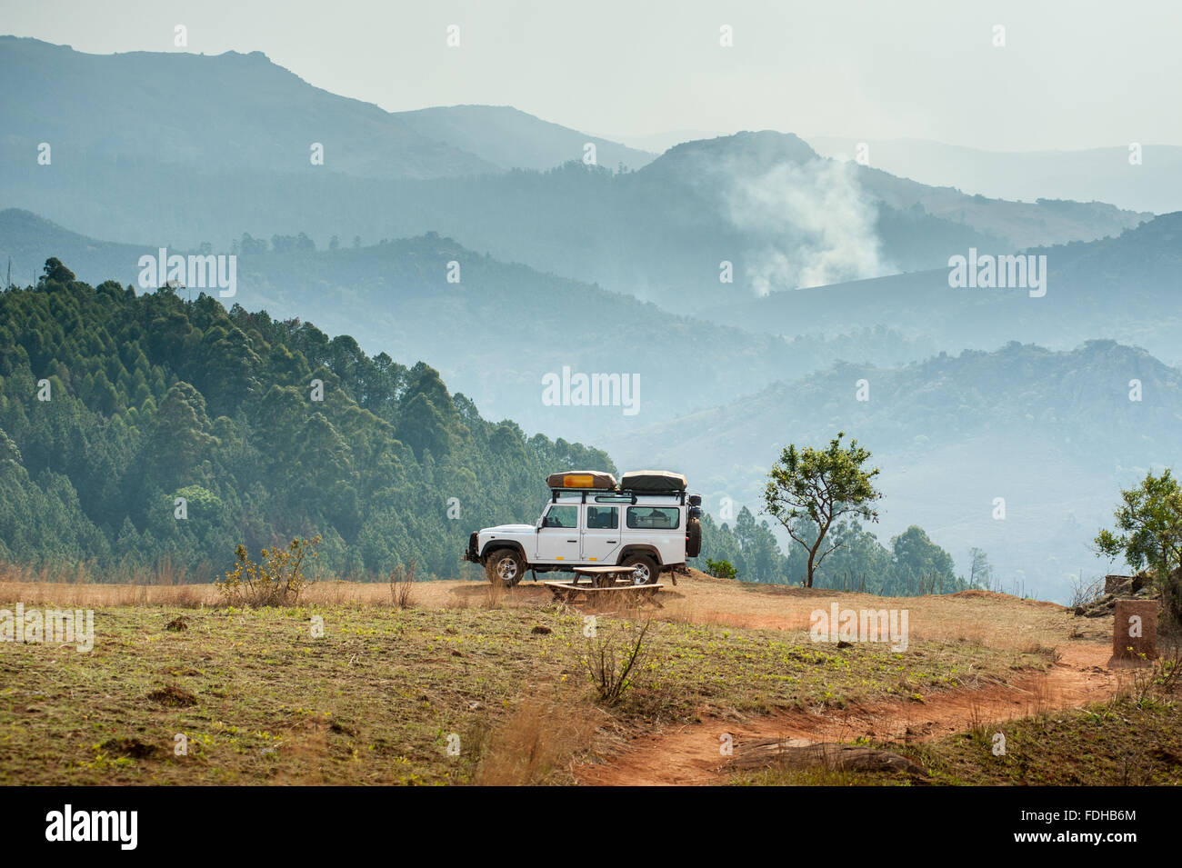 Landrover Defender parked on the edge of a cliff in Mlilwane Wildlife Sanctuary in Swaziland, Africa. Stock Photo