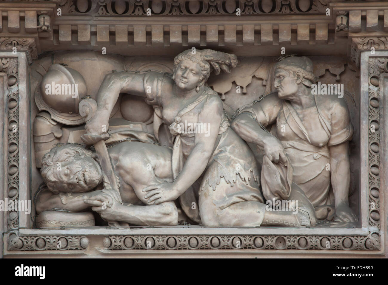 Judith beheading Holofernes. Marble relief on the main facade of the Milan Cathedral (Duomo di Milano) in Milan, Lombardy, Italy. Stock Photo