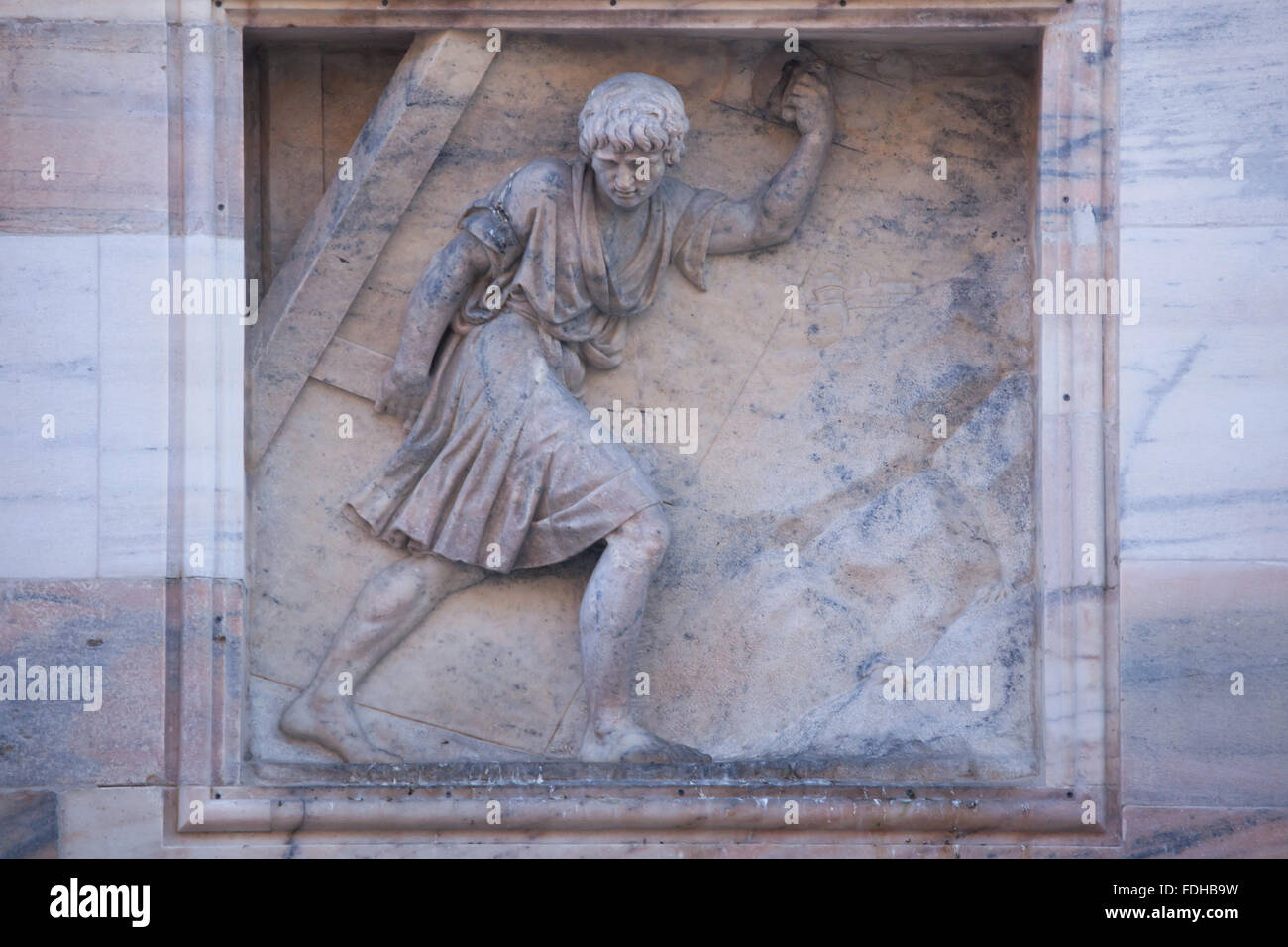 Samson carries away the Gates of Gaza. Marble relief on the north facade of the Milan Cathedral (Duomo di Milano) in Milan, Lombardy, Italy. Stock Photo