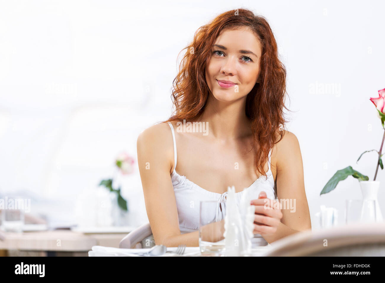 Portrait of young pretty woman sitting at cafe Stock Photo - Alamy