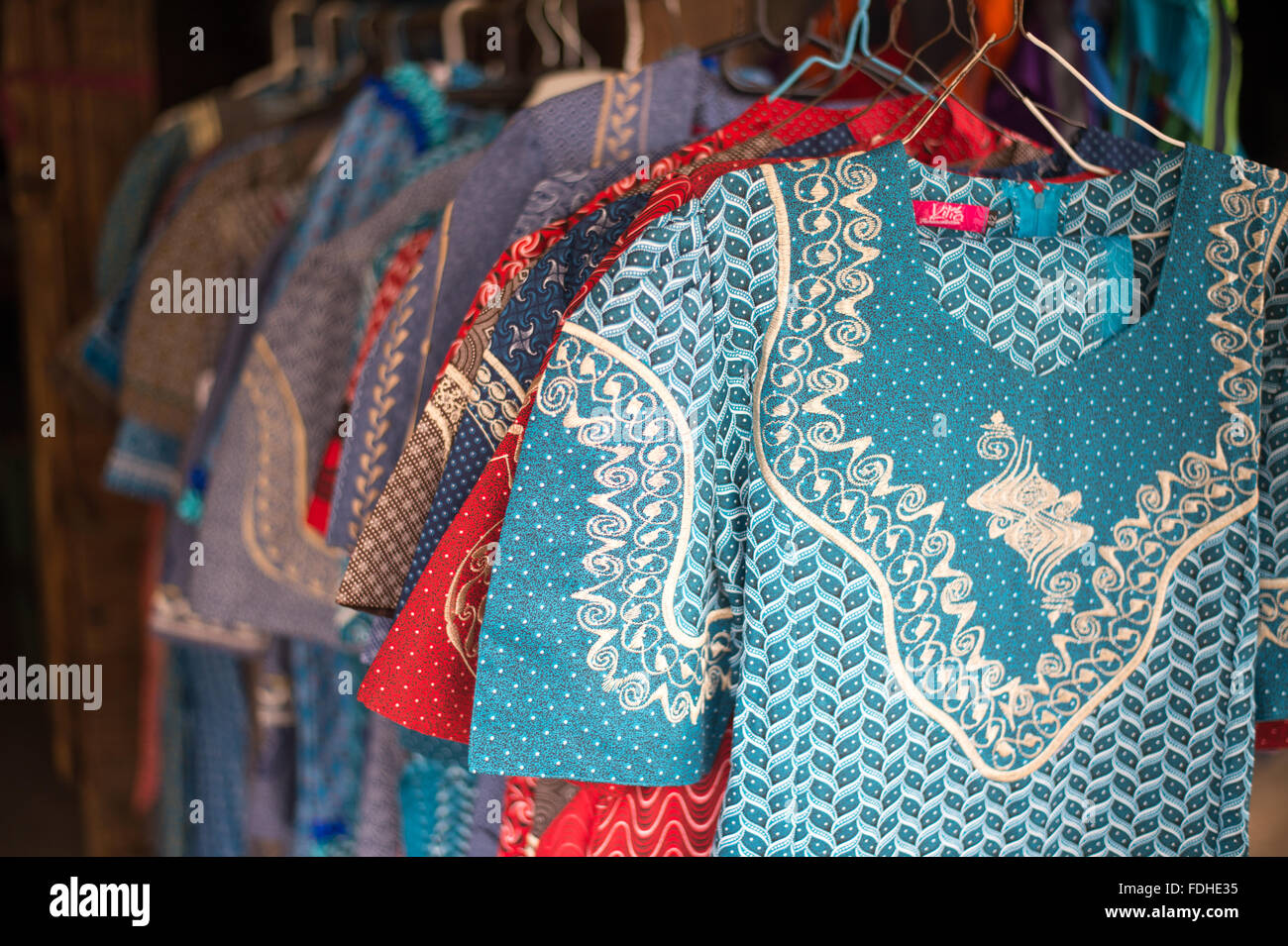 Traditional African dresses for sale at the Manzini Wholesale Produce and Craft Market in Swaziland, Africa Stock Photo
