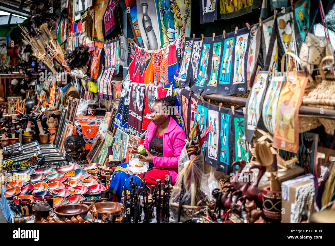 Woman selling artwork at the Manzini Wholesale Produce and Craft Market in Swaziland, Africa. Stock Photo