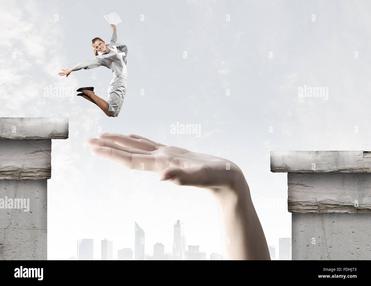 Businesswoman jumping over gap. Risk and challenge concept Stock Photo ...