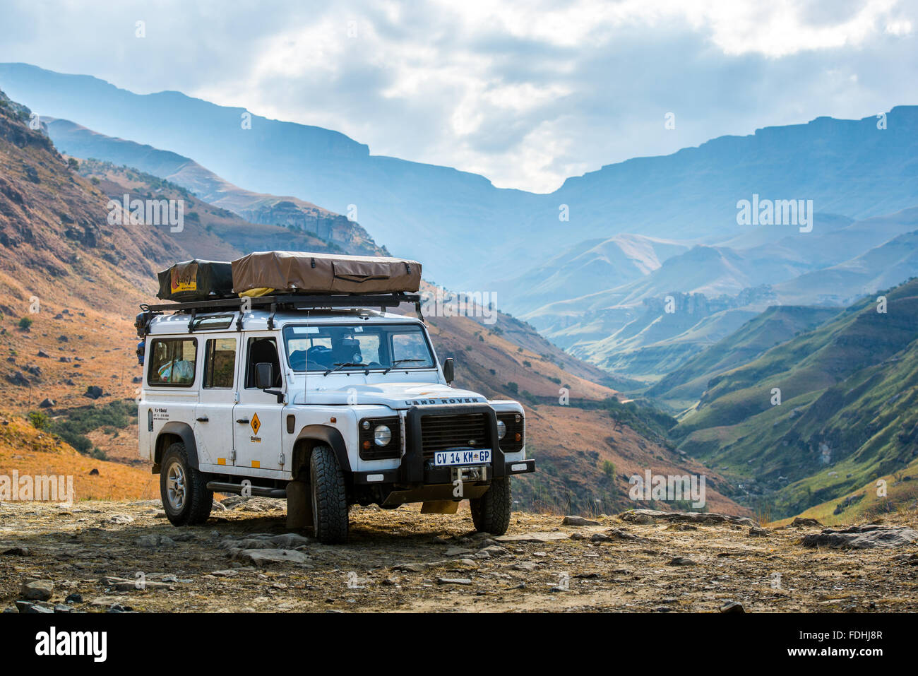 Land Rover Defender parked with mountains in the background in Sani Pass,  between South Africa and Lesotho Stock Photo - Alamy