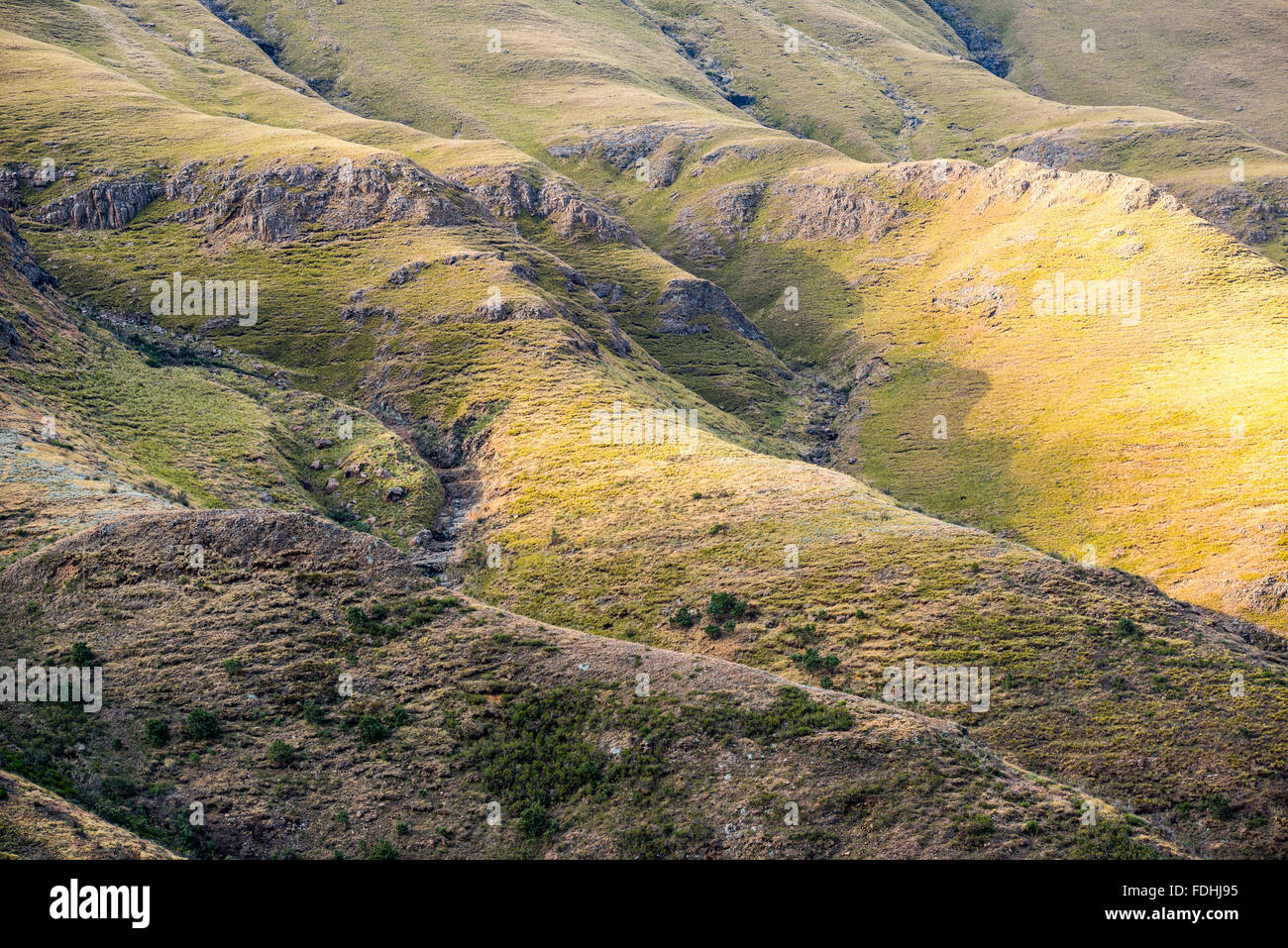 Rolling green hills in Sani Pass, between South Africa and Lesotho. Stock Photo