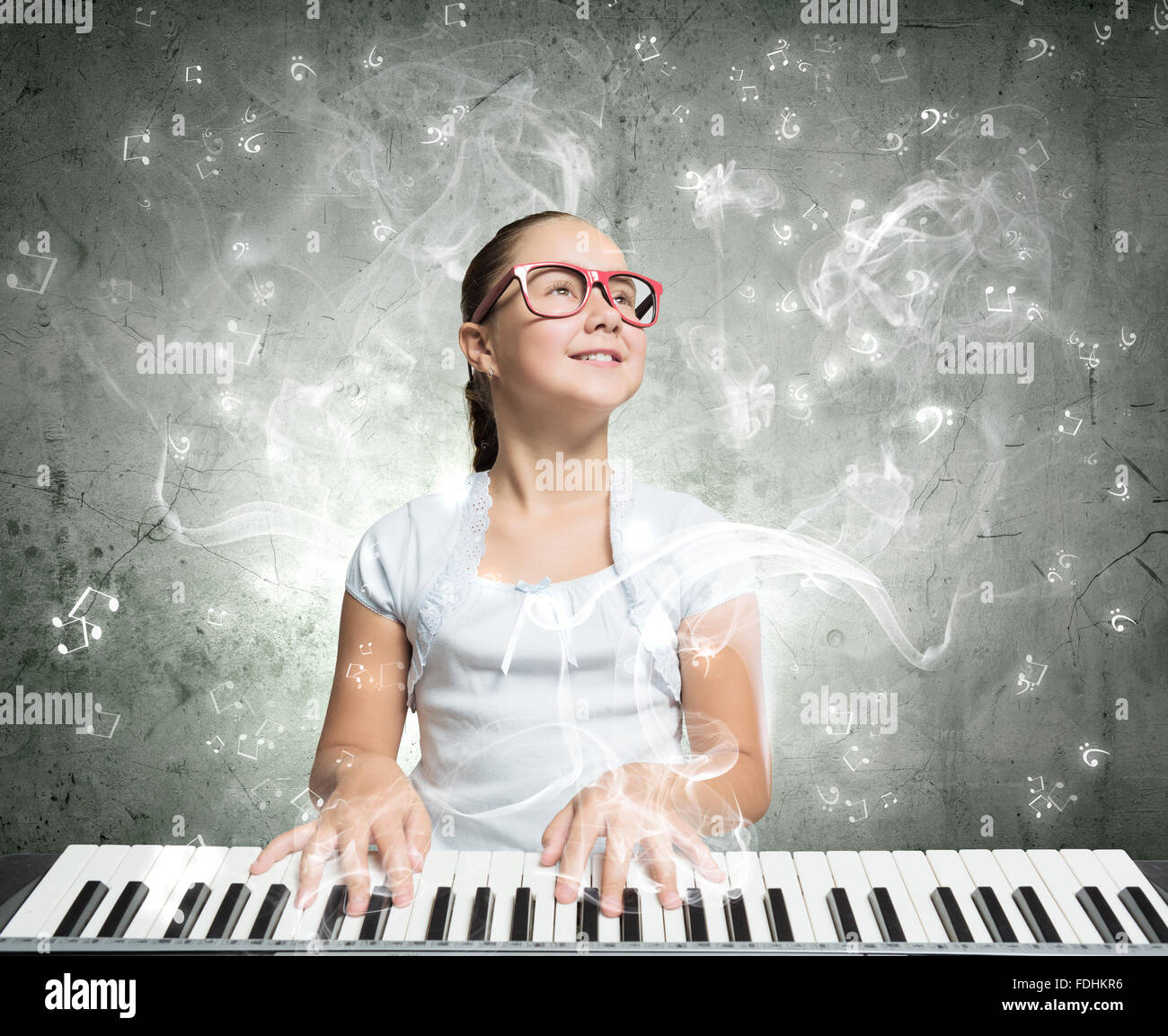 Pretty school girl in funny glasses playing piano Stock Photo - Alamy