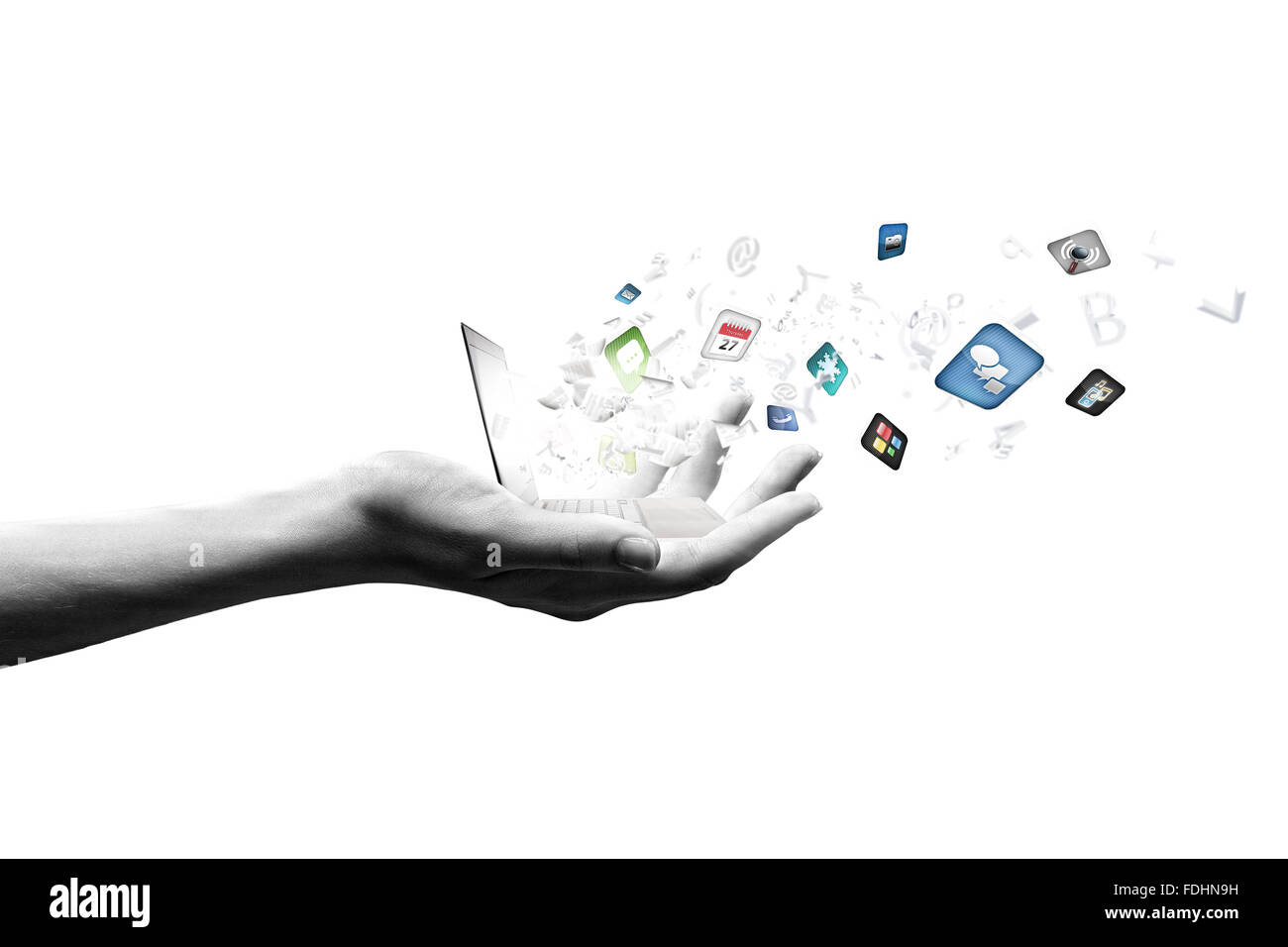 Close up of hand with laptop and media icons Stock Photo - Alamy