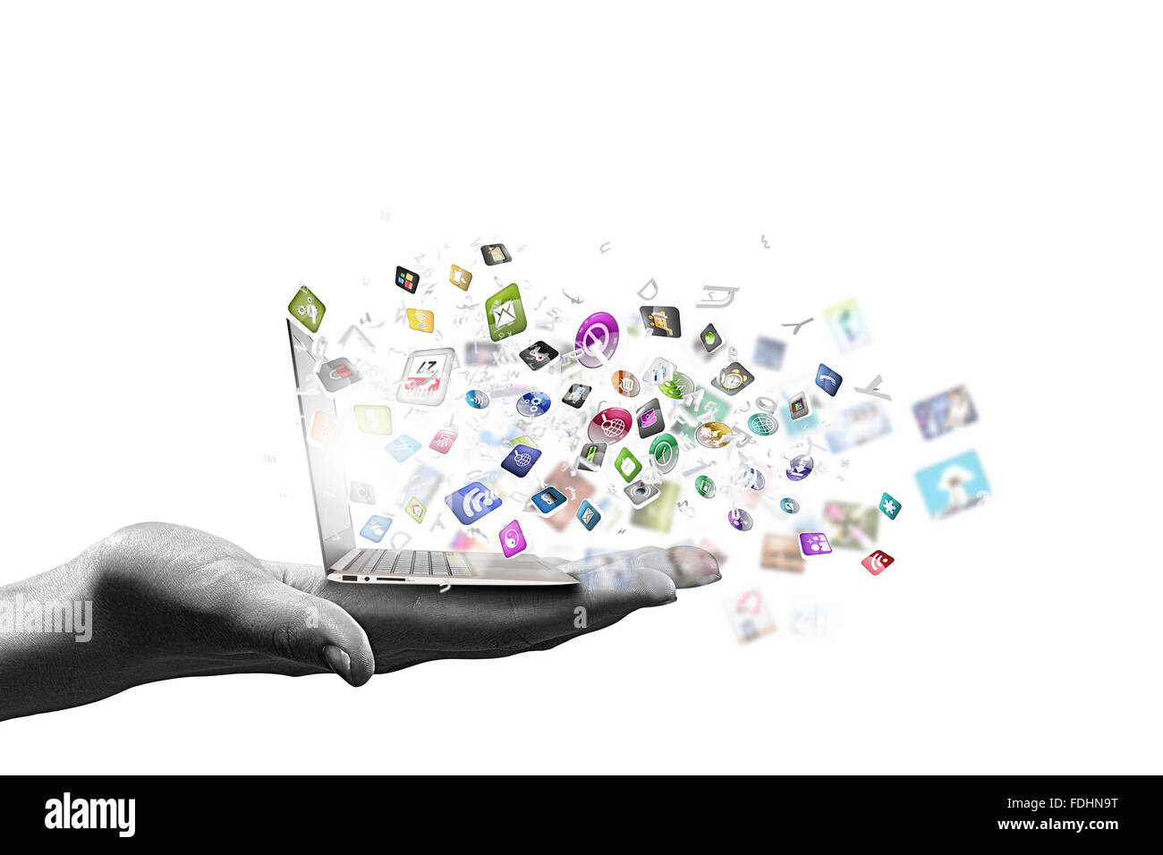 Close up of hand with laptop and media icons Stock Photo - Alamy