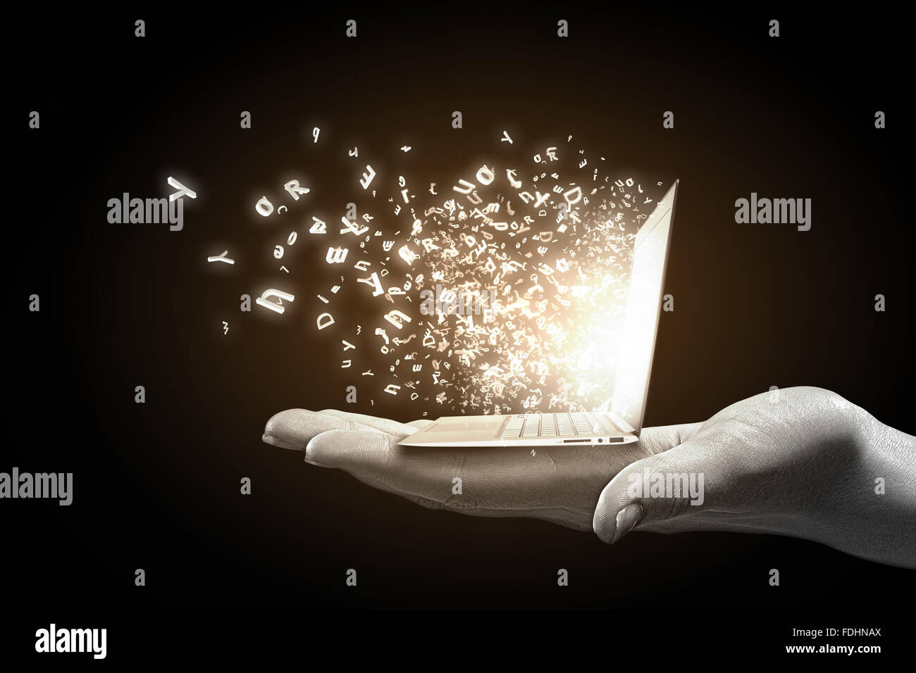 Close up of hand with laptop and media icons Stock Photo - Alamy