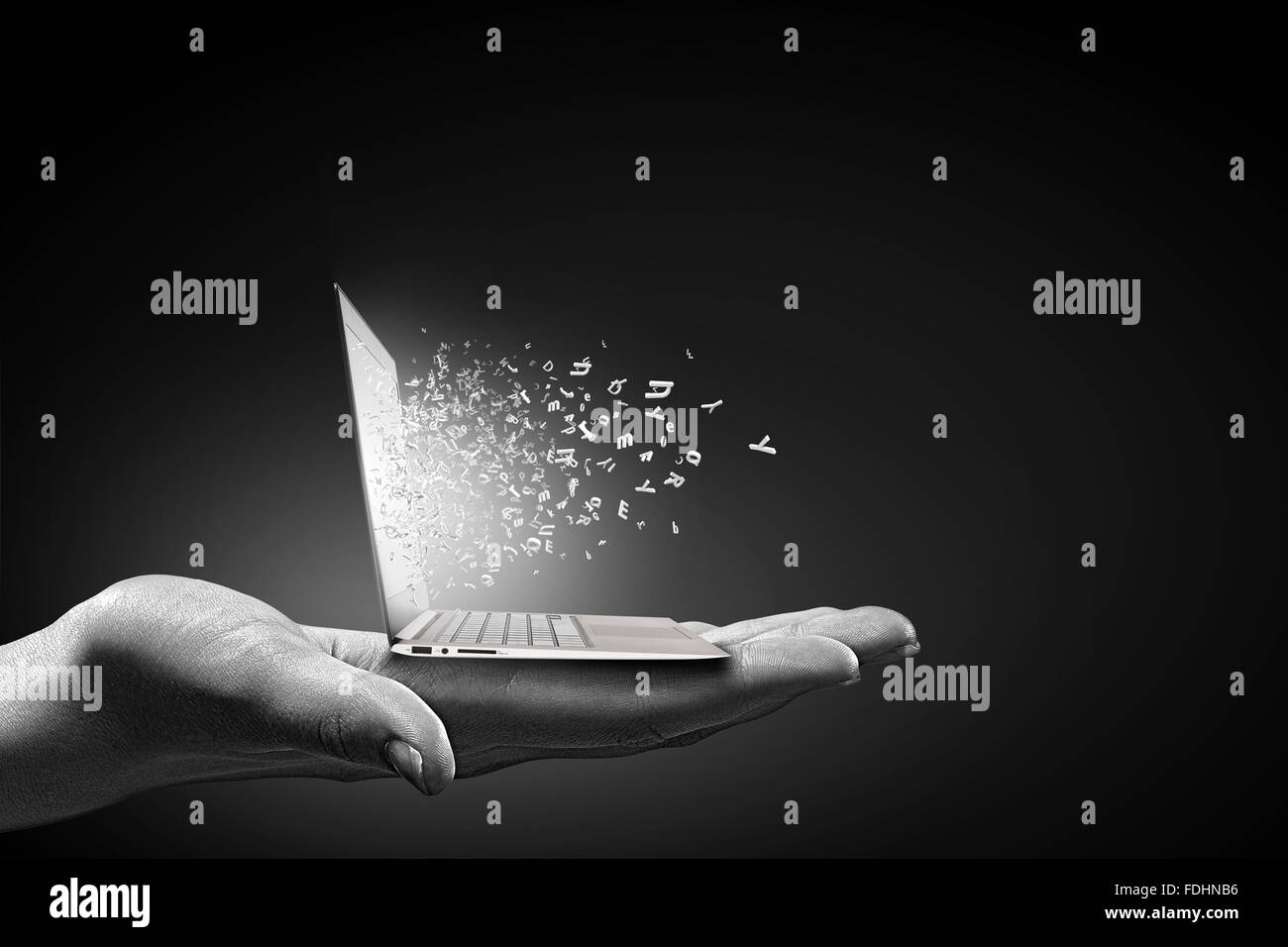 Close up of hand with laptop and media icons Stock Photo - Alamy
