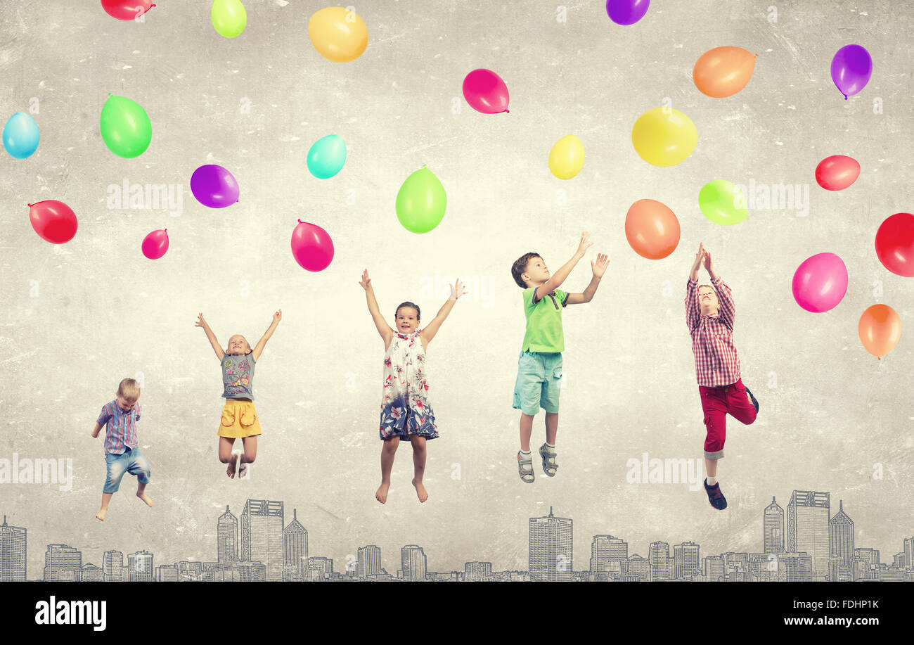 Group of happy children playing with colorful balloons Stock Photo - Alamy