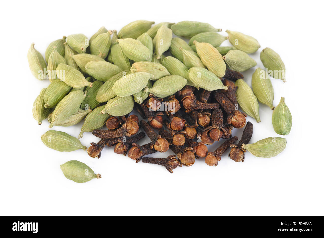 green cardamom pods and cloves on white background Stock Photo Alamy