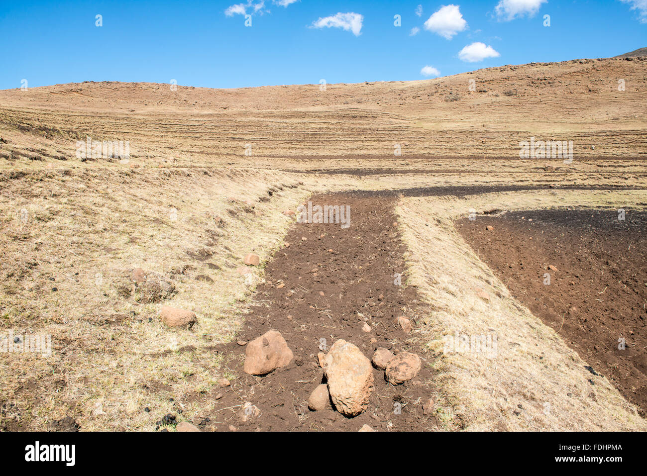 Dirt driving road with extreme terrain through Somenkong, Lesotho, Africa Stock Photo
