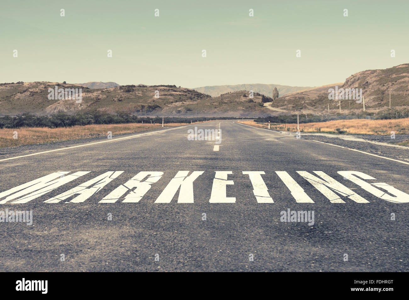 Asphalt road with word marketing as business motivation Stock Photo Alamy