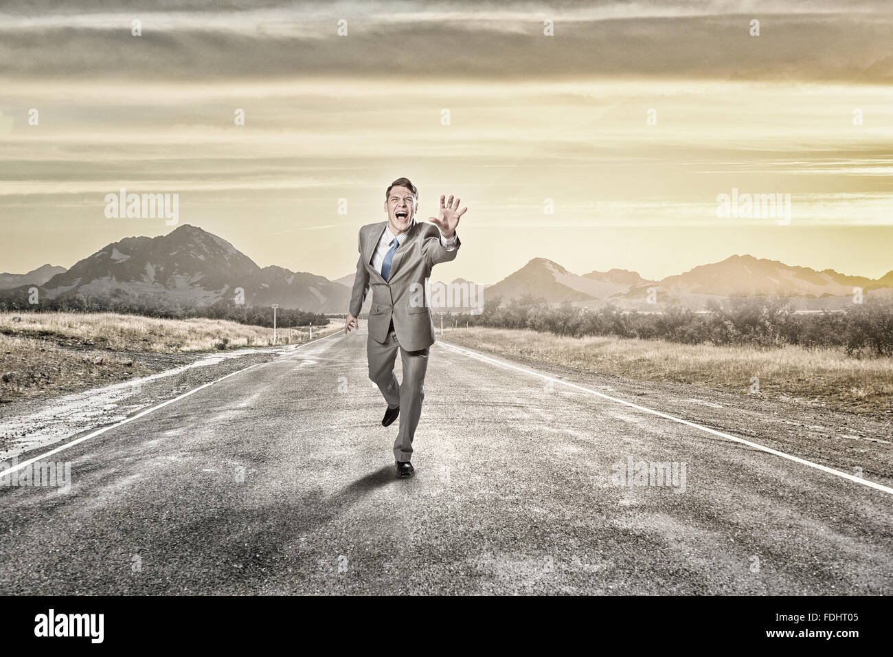 Runned Screamed Young screaming businessman running on asphalt road hi-res stock ...