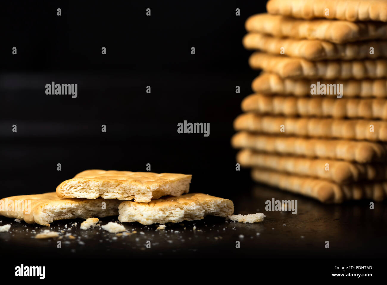 Crispy crackers against a black background Stock Photo
