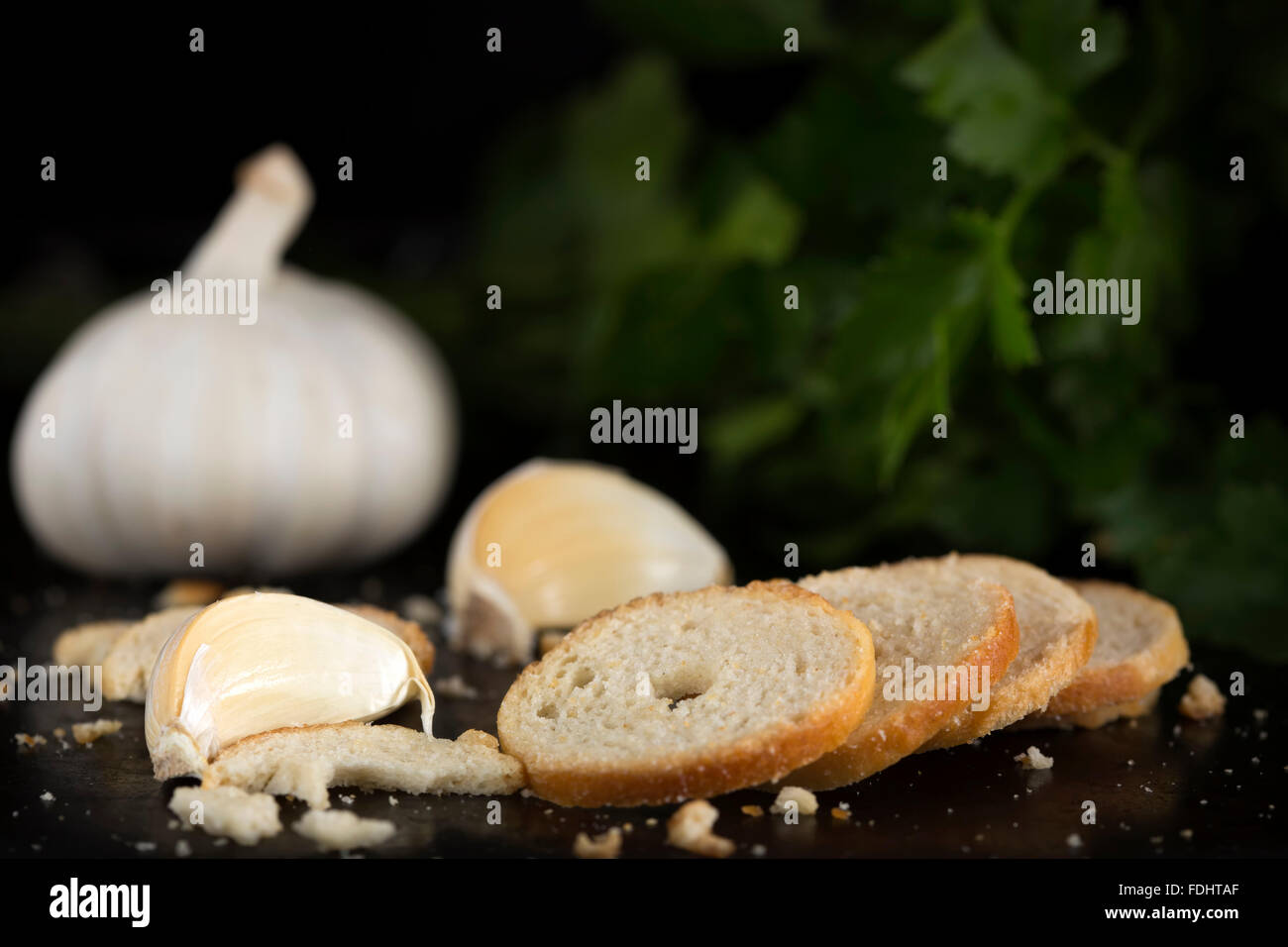 Delicious garlic crackers over dark background Stock Photo