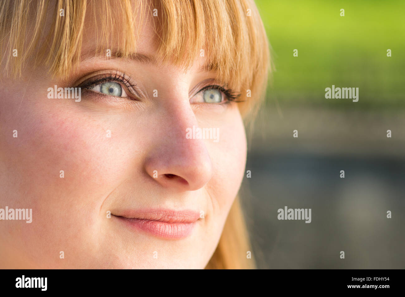 Young confident student girl with grey eyes. Close up portrait with copy space aside Stock Photo