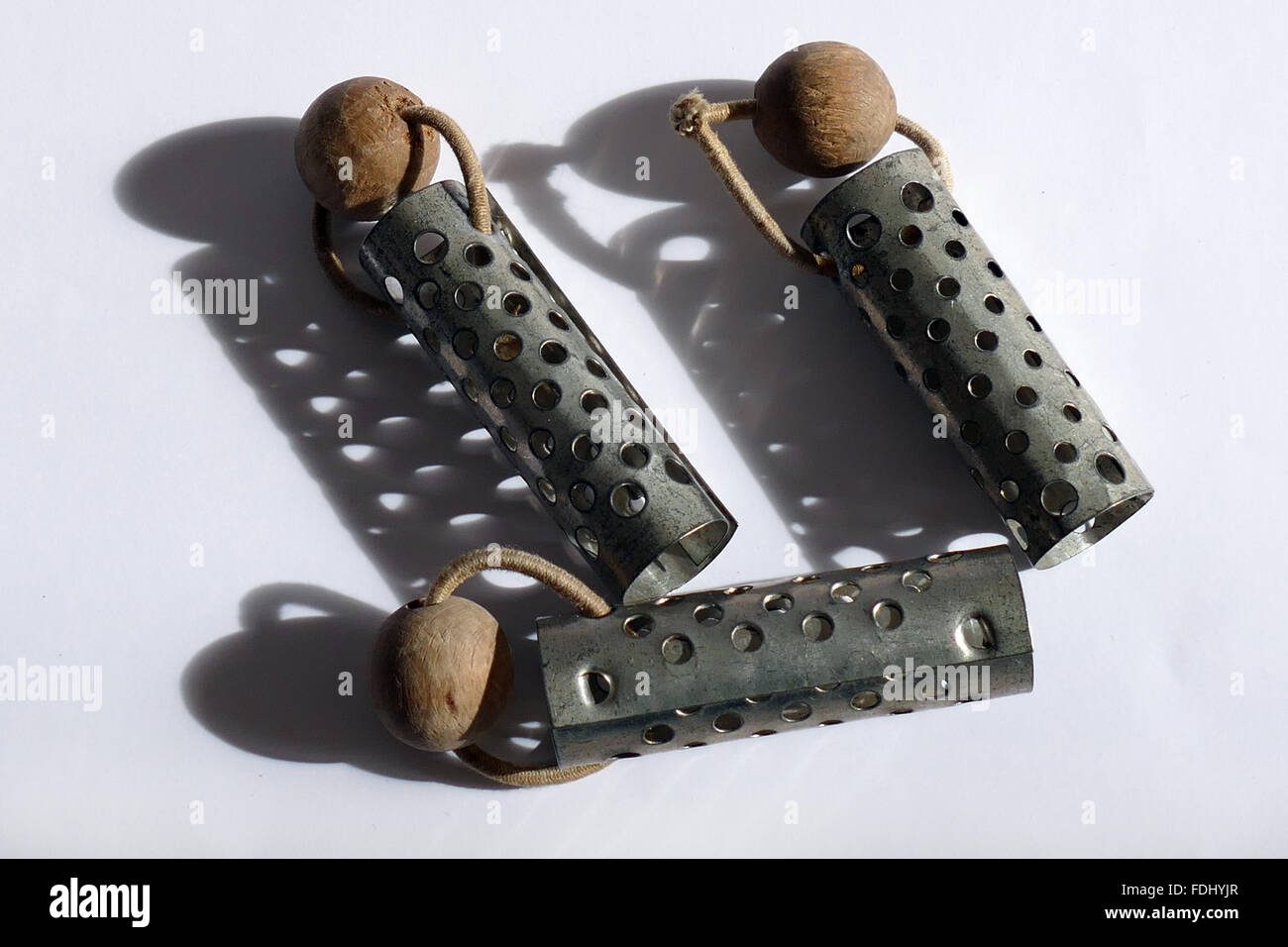 Old metal rollers for hair styling. Stock Photo