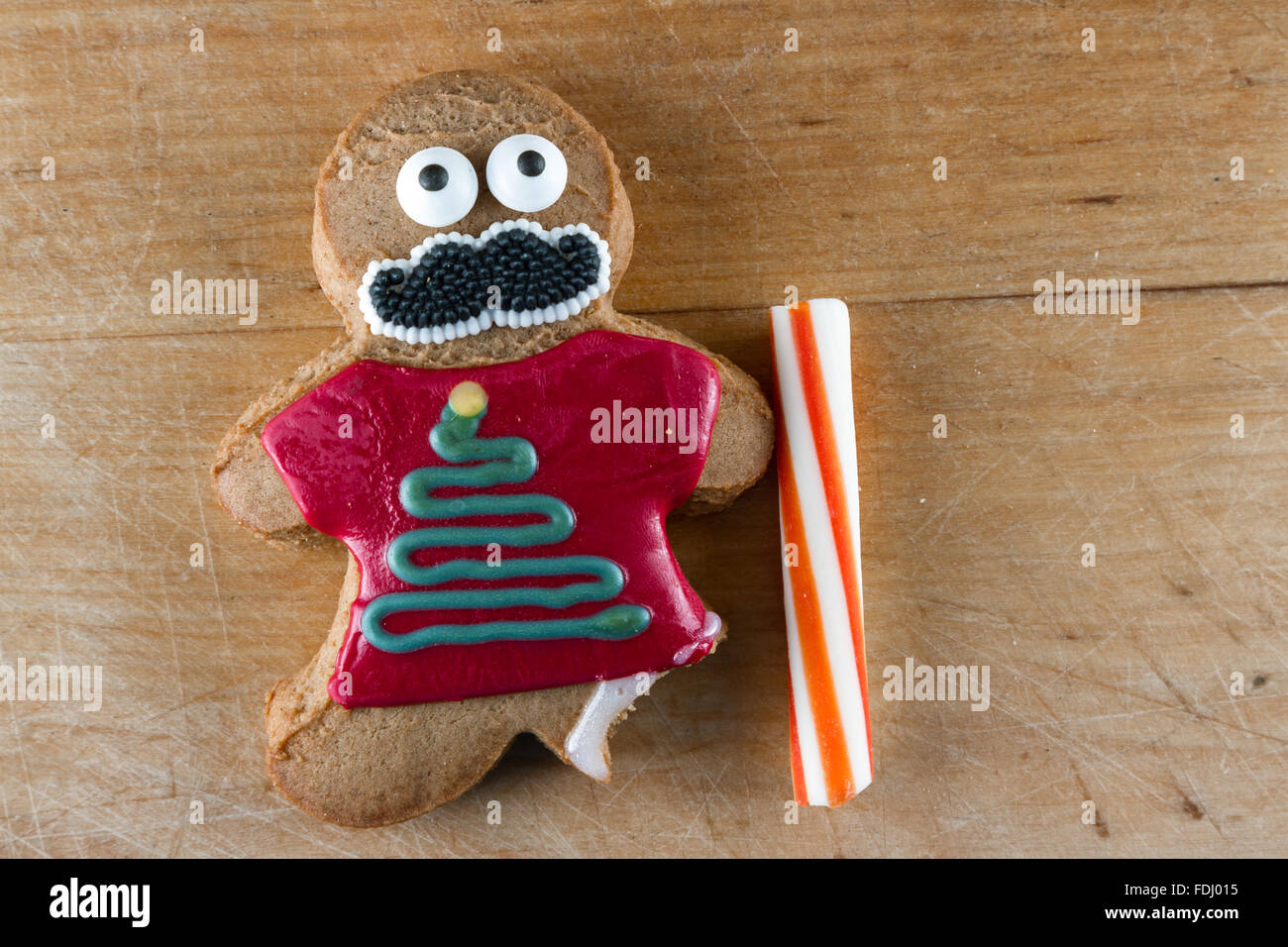 funny gingerbread cookies wearing ugly holiday sweaters and eyes