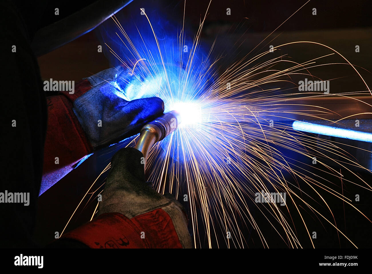 Welder working in a factory Stock Photo