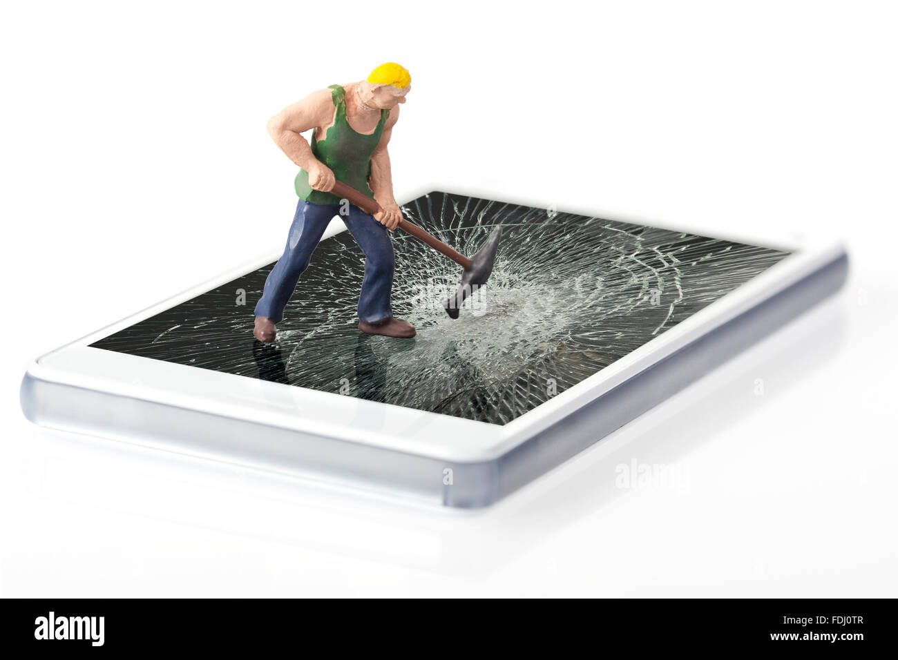 Miniature worker breaking glass of smart phone Stock Photo