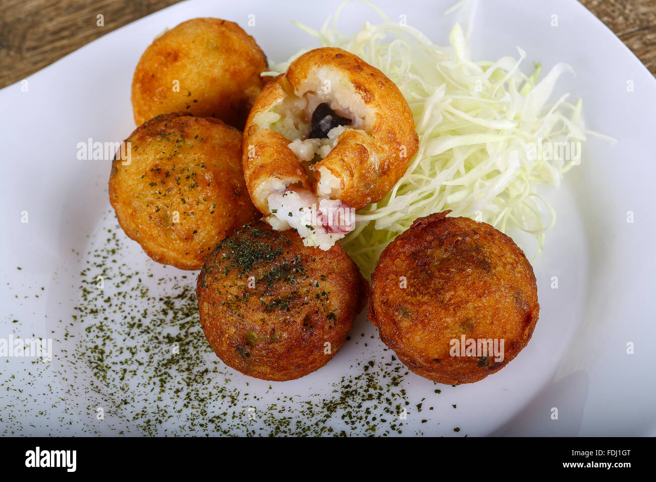 Japanese octopus balls with herbs and spices Stock Photo - Alamy