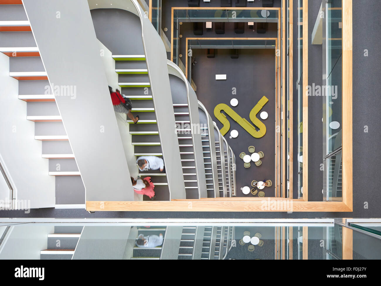 Bird's eye view into multi-storey foyer with staircases. 5 Pancras Square, London, United Kingdom. Architect: Bennetts Associate Stock Photo