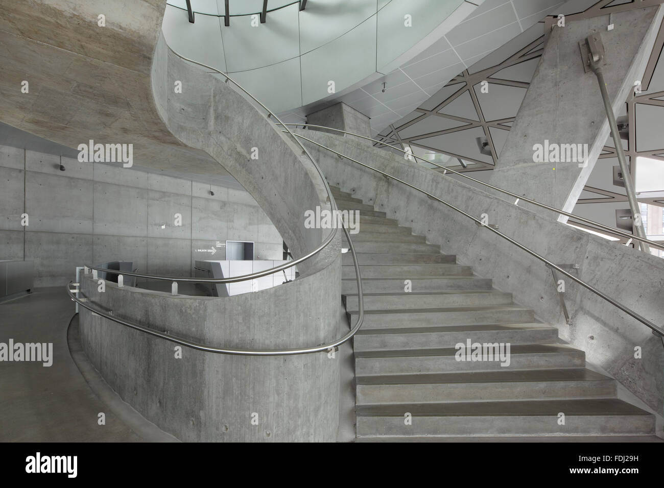 detail of mezzanine level of spiral concrete staircase musikkens