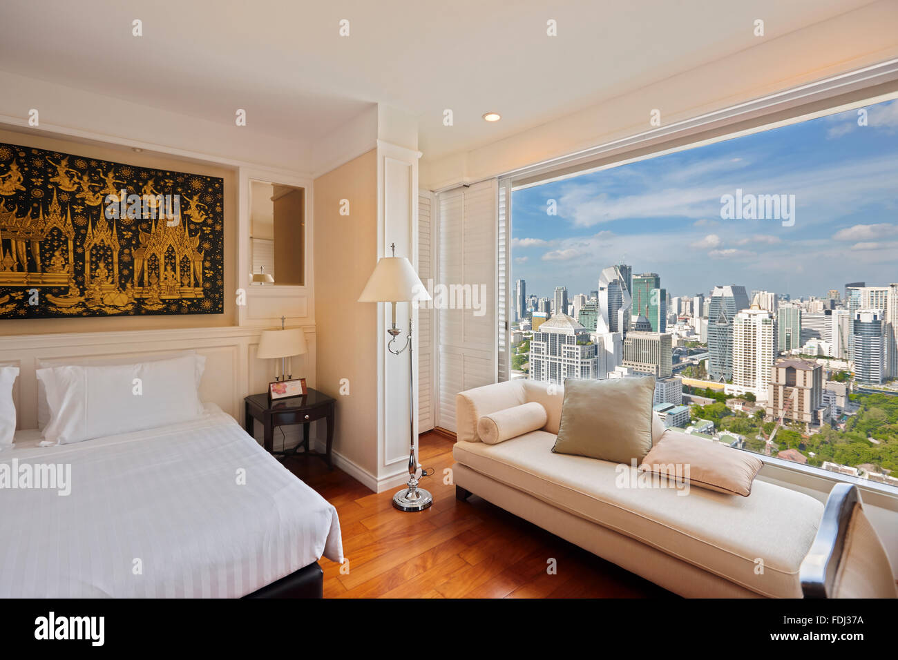 Interior of a hotel room with panoramic view of the city. Grande Centre Point Hotel Ratchadamri, Bangkok, Thailand. Stock Photo