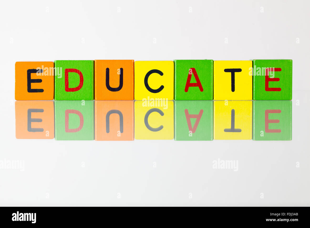Educate - an inscription from children's wooden blocks Stock Photo