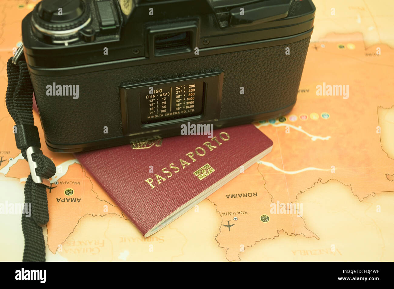 analog camera, italian passport and a brazilian map Stock Photo - Alamy