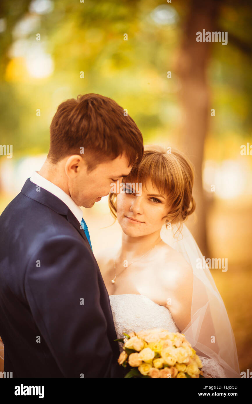 young bride and groom on the bluer background Stock Photo - Alamy