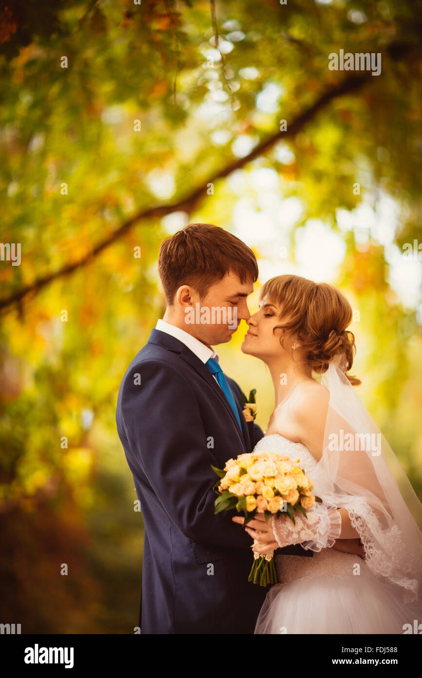young bride and groom on the bluer background Stock Photo - Alamy