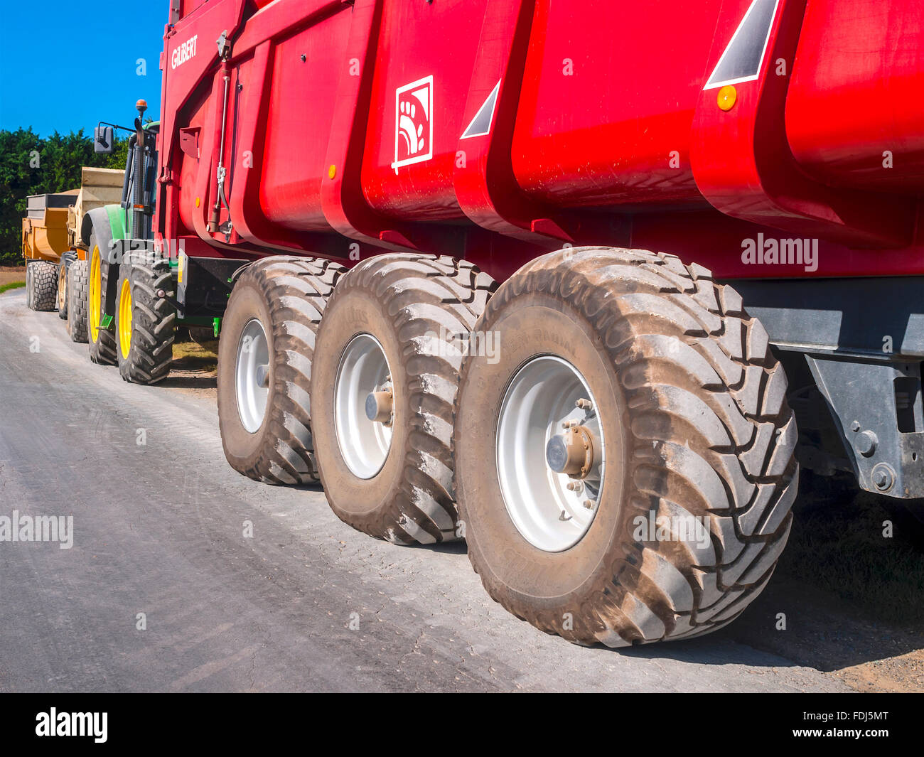 Line of farm trailers - France. Stock Photo