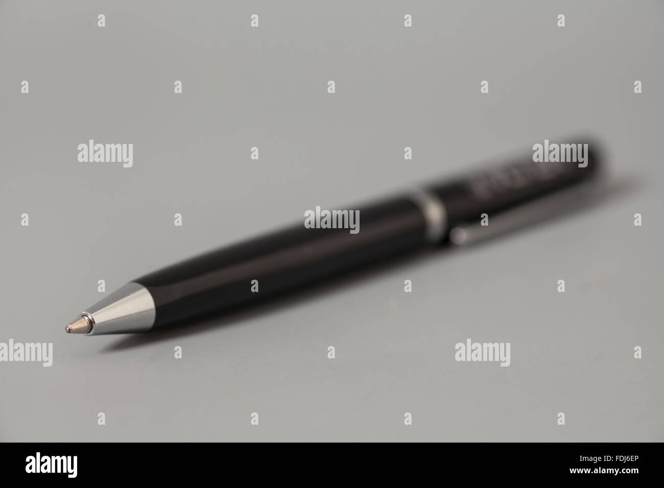 Ball point pen  on gray background Stock Photo