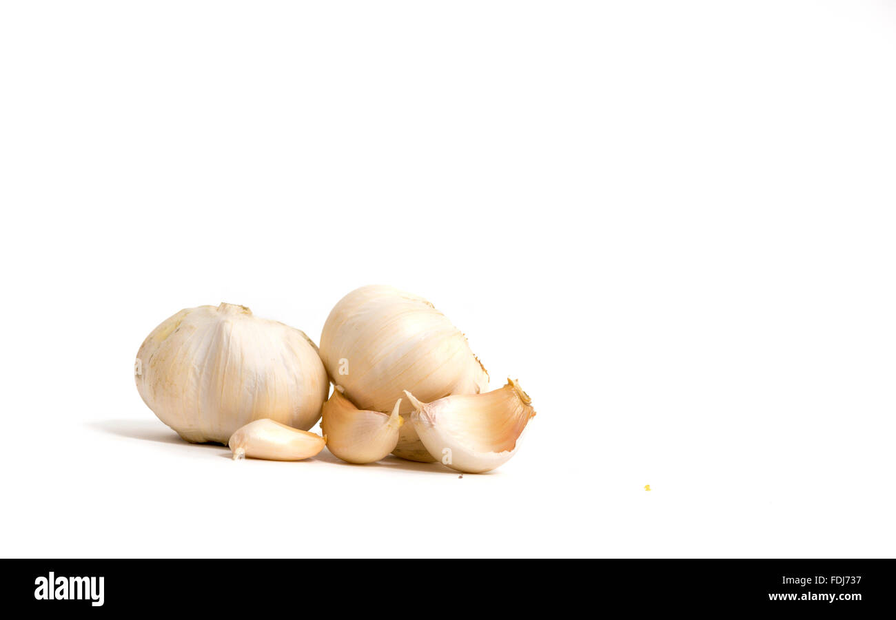 fresh garlic cloves isolated on white background Stock Photo - Alamy