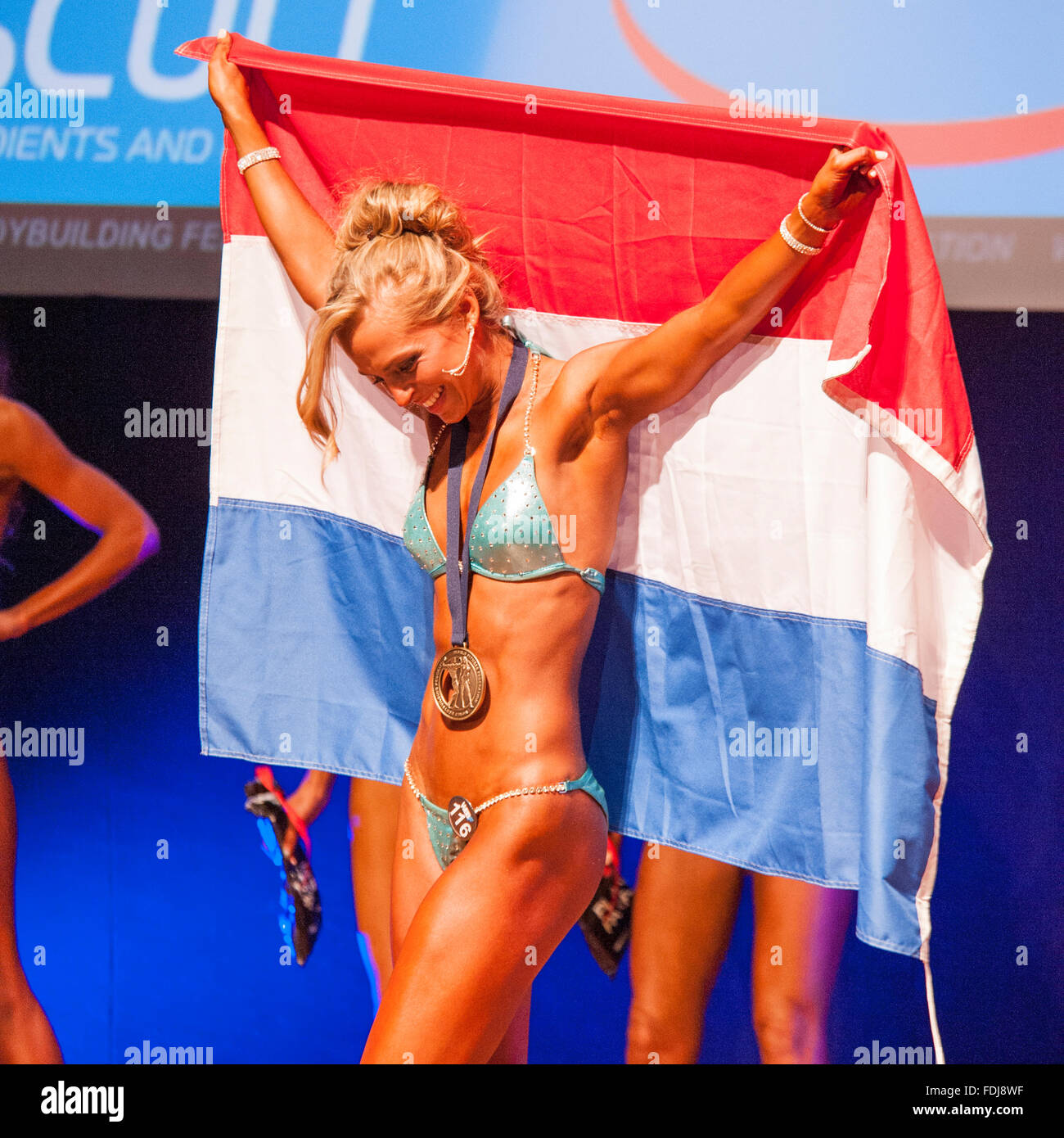 MAASTRICHT, THE NETHERLANDS - OCTOBER 25, 2015: Female figure model Larissa van Meerten celebrates her victory Stock Photo