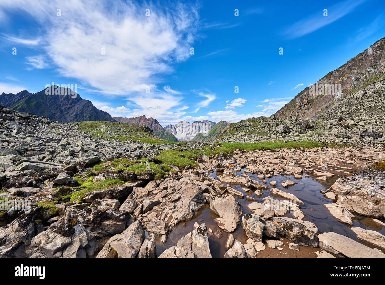 Fragments of rocks in water. Hanging Valley in the alpine tundra of eastern Siberia . Russia Stock Photo