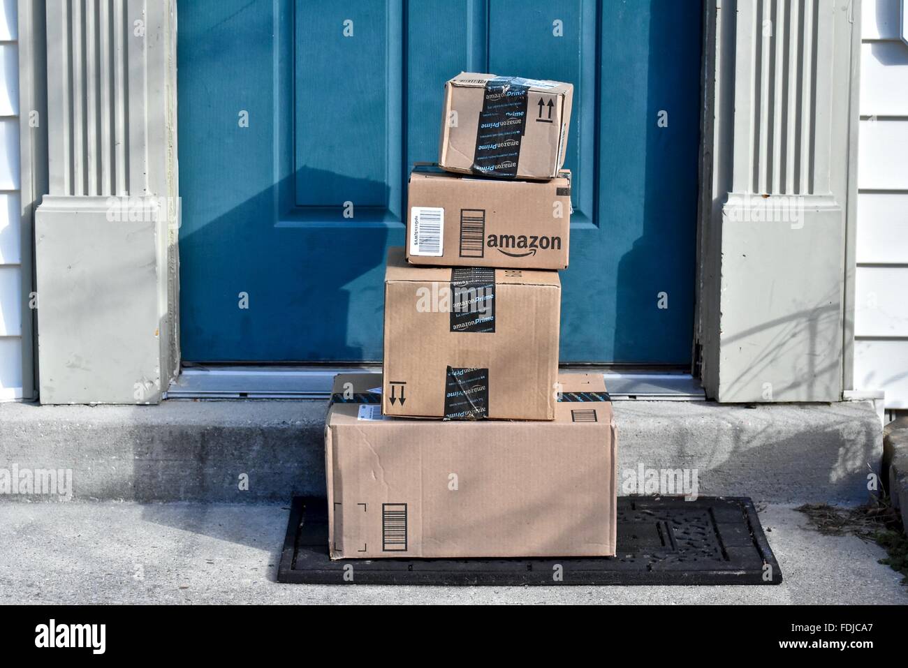 Amazon boxes delivered to a house. Stock Photo