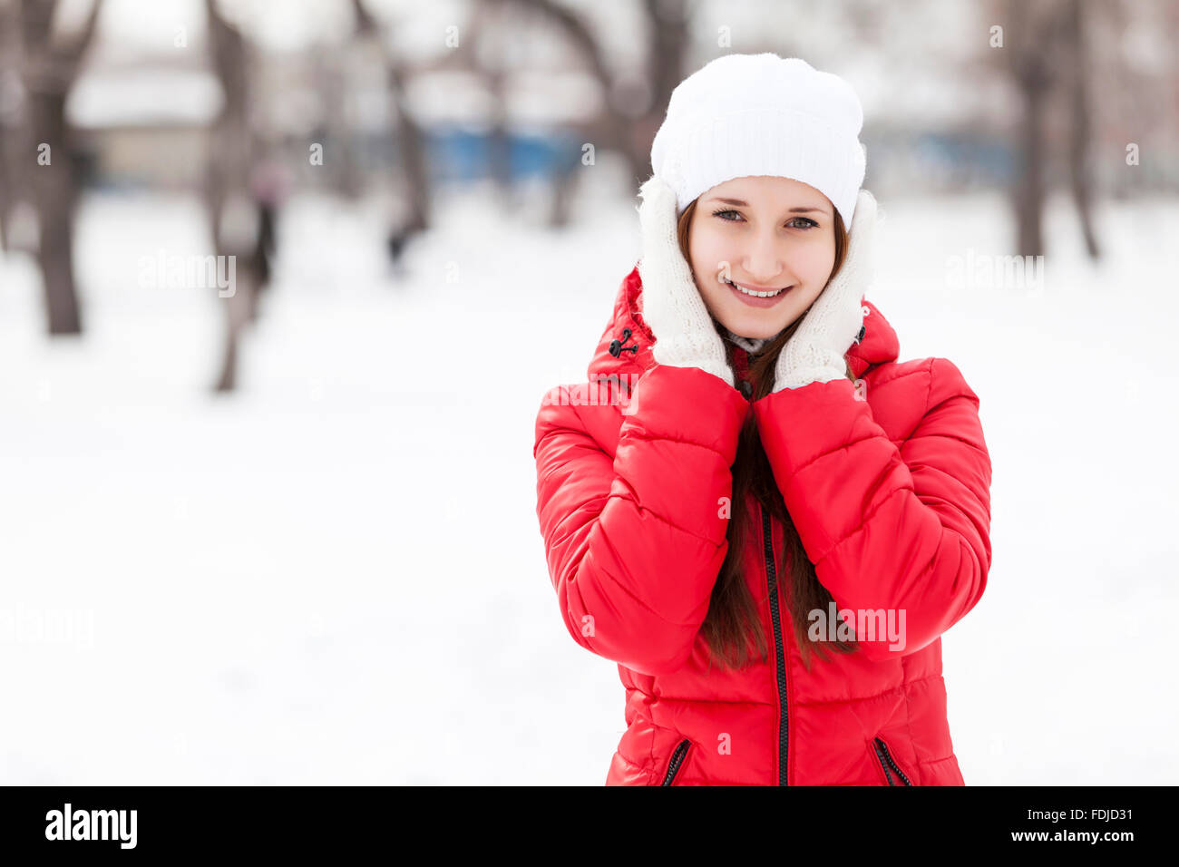 The beautiful smiling woman on walk in winter wood Stock Photo - Alamy