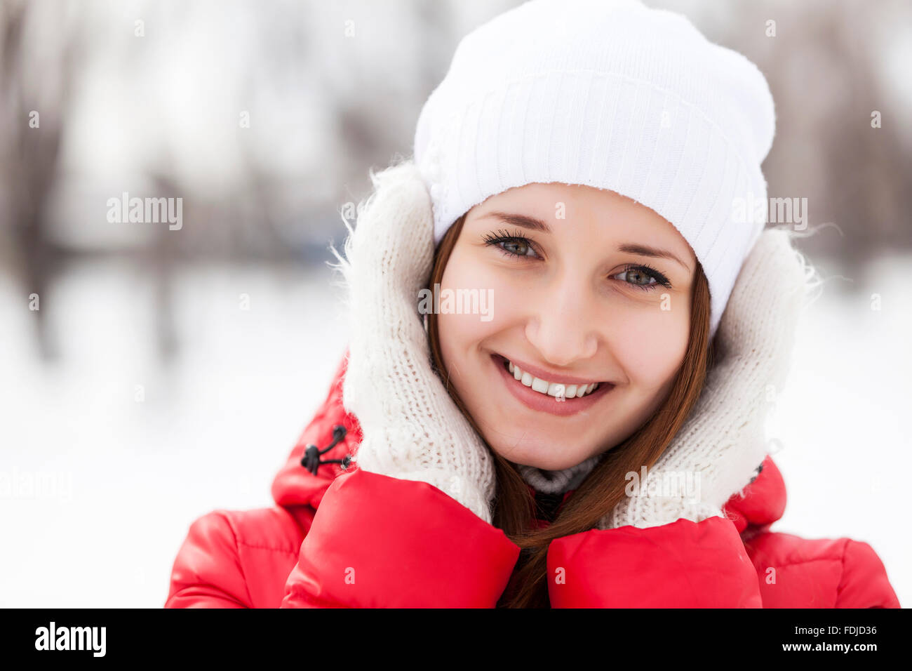 The beautiful smiling woman on walk in winter wood Stock Photo - Alamy