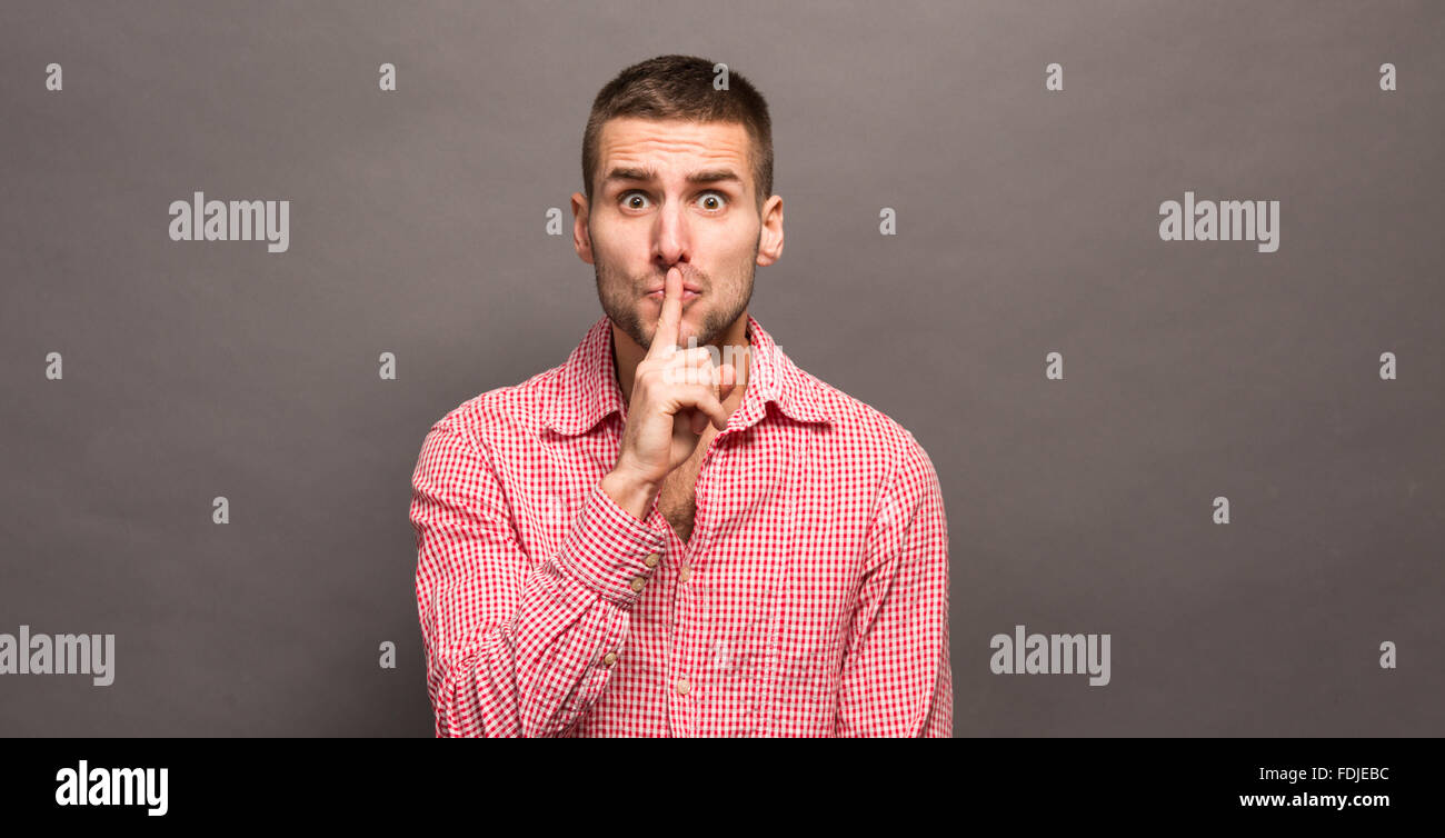 Man making a shushing gesture Stock Photo