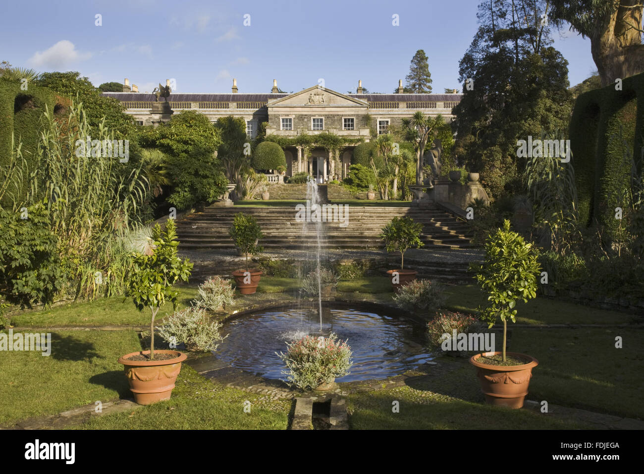 A view across the formal Italian Garden towards the nineteenth century house at Mount Stewart, Co. Down, Northern Ireland. Edith, Lady Londonderry created the garden in the 1920s. Stock Photo